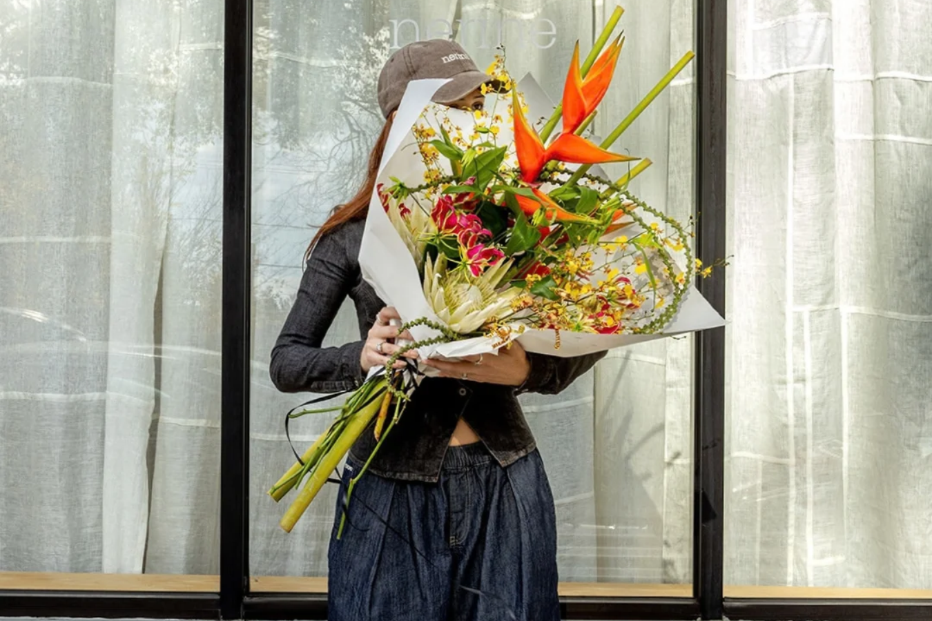 Woman holding a bouquet.